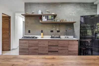 a kitchen with a sink and a stove at TERRA - Heated Small Pool, BBQ & AC Lleras Park in Medellín