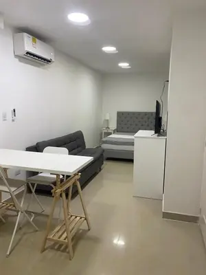a living room with a couch and a table at Apartahotel Provenza in Medellín