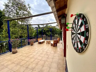 a dart board on the side of a house at Finca Balvanera in Sopetran