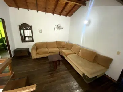 a living room with a couch and a table at Finca Balvanera in Sopetran