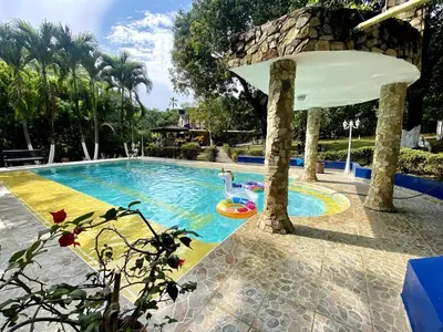 a swimming pool at a resort with a swimming pool at Finca Balvanera in Sopetran