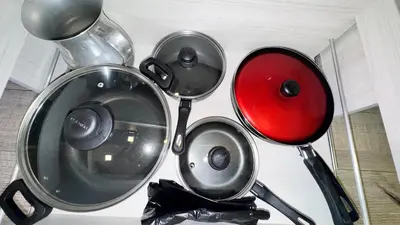 a group of pots and pans hanging on a wall at 2103 Apto de lujo Poblado Medellín in Medellín