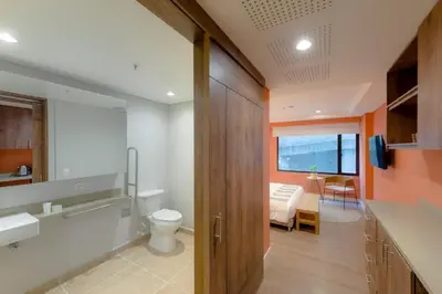 a bathroom with a sink and a toilet in a room at Luxury Escape by El Tesoro Perfect Location 302 in Medellín