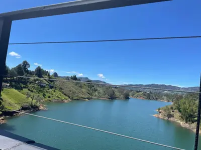 a view of a river from a bridge at Beautiful cabin Guatapé vista-acceso al lago in La Pradera