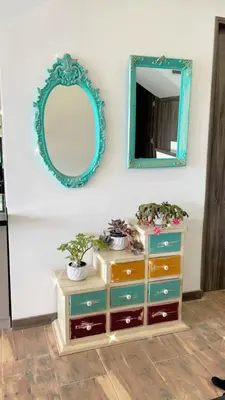 a dresser with a mirror on a wall at Beautiful cabin Guatapé vista-acceso al lago in La Pradera