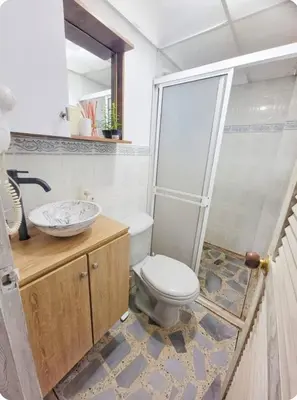 a bathroom with a toilet and a sink at exclusive apartment in laureles Estadio in Medellín