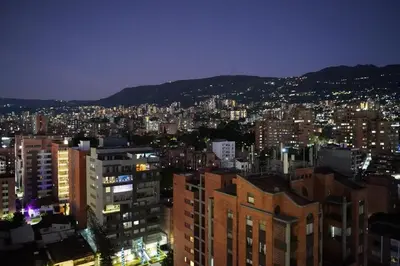 a view of a city at night with buildings at Deluxe apartment with an incredible view in envigado in Envigado