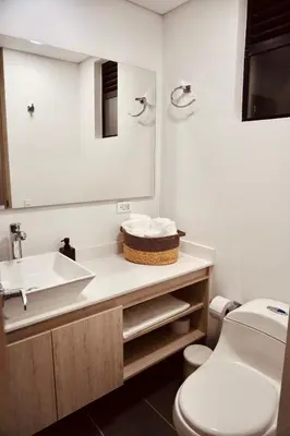a bathroom with a sink and a toilet at Deluxe apartment with an incredible view in envigado in Envigado