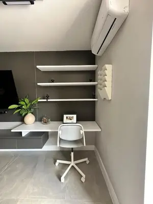 a white desk with a chair in a room at Luxury penthouse with Jacuzzi and AC, North Medellin in Medellín