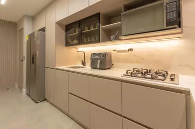 a kitchen with a stove and a microwave at Luxury penthouse with Jacuzzi and AC, North Medellin in Medellín