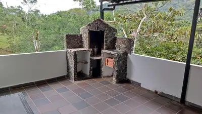 an open door in a building with a balcony at Cabaña en la CRISTALINA San Rafael embrujo de aguas cristalinaa in San Rafael