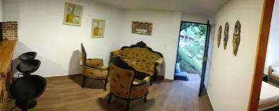 a room with a bunch of chairs on the wall at Cabaña en la CRISTALINA San Rafael embrujo de aguas cristalinaa in San Rafael