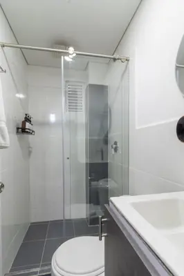 a bathroom with a shower and a toilet and a sink at Charming scape cozy and stylish N Medellin in Medellín