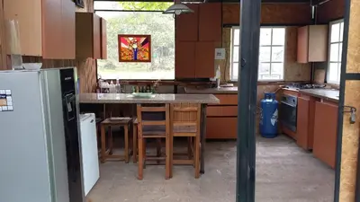 a kitchen with a island in the middle of it at Cabin with River in San Rafael