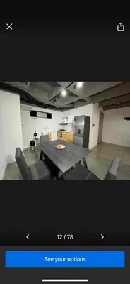 a picture of a room with a table and chairs at Casashots in Medellín