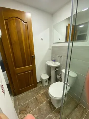 a bathroom with a toilet and a sink at Hotel Don Pacho in Los Andes