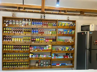 a store with a lot of drinks and a refrigerator at Hotel Don Pacho in Los Andes