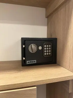 a black microwave sitting on top of a shelf at Apartaestudio en el Corazón del Oriente Antioqueño in La Ceja