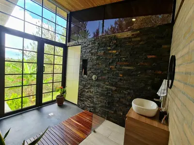 a bathroom with a sink and a large window at Los Pinos in Guatapé