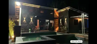 a house with a swimming pool at night at Altos del silencio in San Rafael