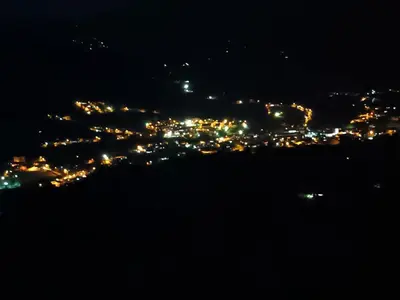 a view of a city lit up at night at Altos del silencio in San Rafael