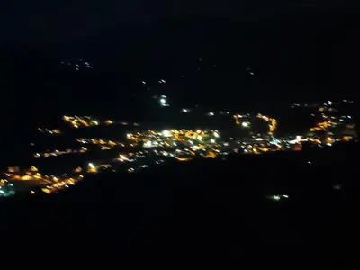 a view of a city lit up at night at Altos del silencio in San Rafael