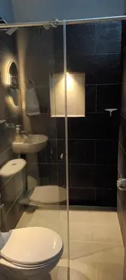 a bathroom with a toilet and a sink at Altos del silencio in San Rafael
