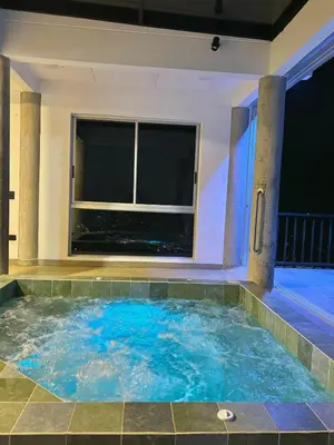 a swimming pool in a house with a window at Villa Entre Nubes in El Hatillo