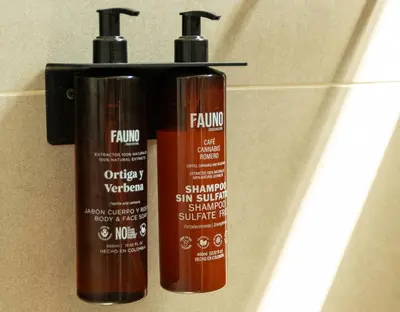 two hair products sitting next to each other on a wall at Nuevo y cálido Loft en Laureles in Medellín