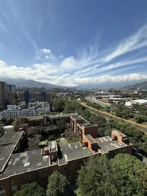 an overhead view of a city with buildings and trees at Apartment in Poblado 17th Floor W Pool in Medellín