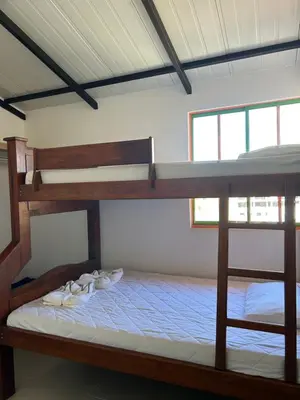 a bedroom with two bunk beds with shoes on them at Apartamento cómodo y tranquilo cerca al parque principal de Guatapé in Guatapé