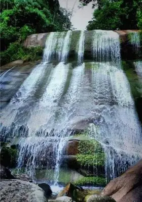 a waterfall in the middle of a river at Apartamento Vacacional in San Carlos Antioquia in San Carlos