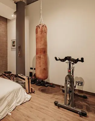 a room with a bed and a bike in a room at Designer Loft, Unique location, Provenza, Lleras in Medellín