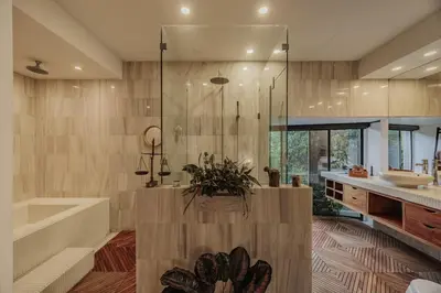 a bathroom with a tub and a sink and a bath tub at Designer Loft, Unique location, Provenza, Lleras in Medellín