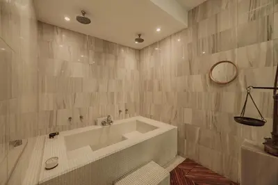 a bathroom with a large tub and a mirror at Designer Loft, Unique location, Provenza, Lleras in Medellín
