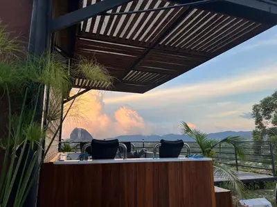 an outdoor hot tub with a view of the mountains at Althuum House in Chiquinquirá