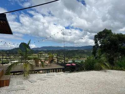 a patio with a bench and a view of the mountains at Althuum House in Chiquinquirá