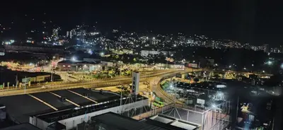 a view of a city at night with a train station at Apartamento Las Vegas Plaza in Sabaneta