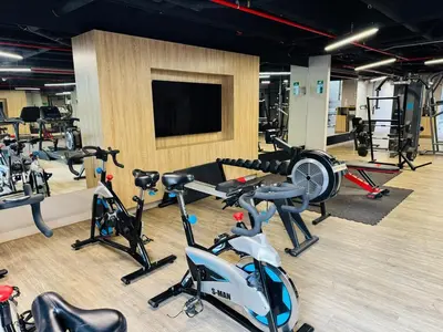 a gym with a bunch of exercise equipment in it at Amazing apartment in Poblado in Medellín