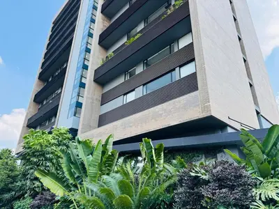 an apartment building with plants in front of it at Amazing apartment in Poblado in Medellín
