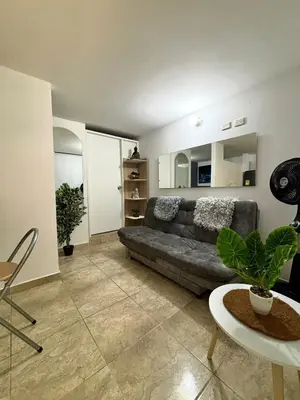 a living room with a couch and a table at Apartamentos Bello Antioquia in Bello