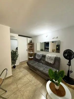 a living room with a couch and a table at Apartamentos Bello Antioquia in Bello