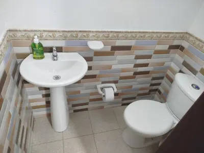 a bathroom with a sink and a toilet at Hospedaje temporal in Carmen de Viboral