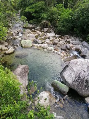 a stream of water with rocks in a river at Ermita del tinte in San Rafael