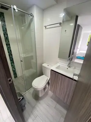 a bathroom with a toilet and a sink and a shower at Apto nuevo, tranquilo y central in Manizales