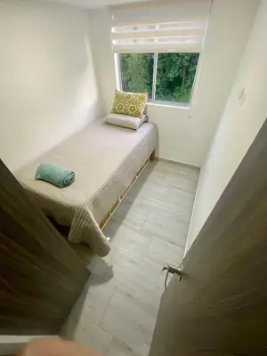 a small room with a bench in front of a window at Apto nuevo, tranquilo y central in Manizales