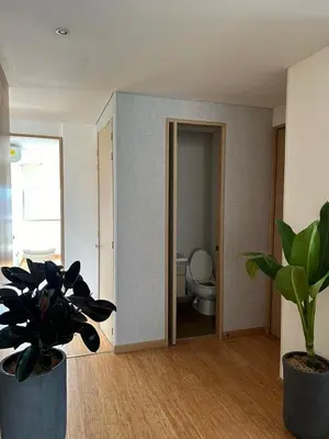 a bathroom with a toilet and plants in a room at Great view 3 bedroom apartment near Provenza 1101 in Medellín