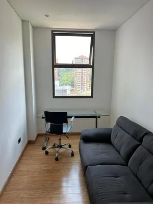 a living room with a couch and a desk at Great view 3 bedroom apartment near Provenza 1101 in Medellín