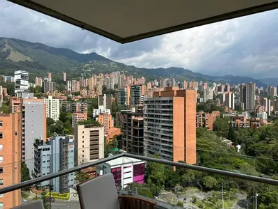 a view of a city with buildings and mountains at Great view 3 bedroom apartment near Provenza 1101 in Medellín