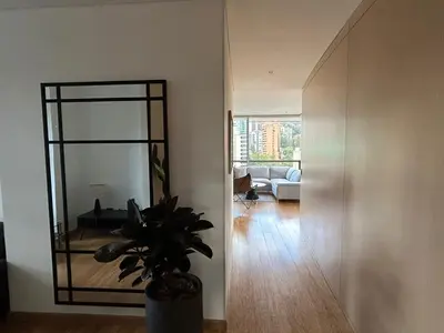 a living room with a mirror and a couch at Great view 3 bedroom apartment near Provenza 1101 in Medellín